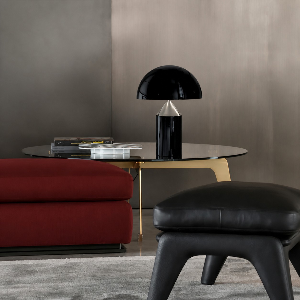 Bright black HaloVell lamp beside a red sofa