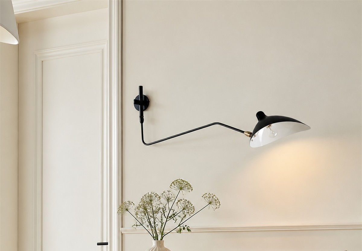 Black Duckbill Wall Sconce centered in a bright interior