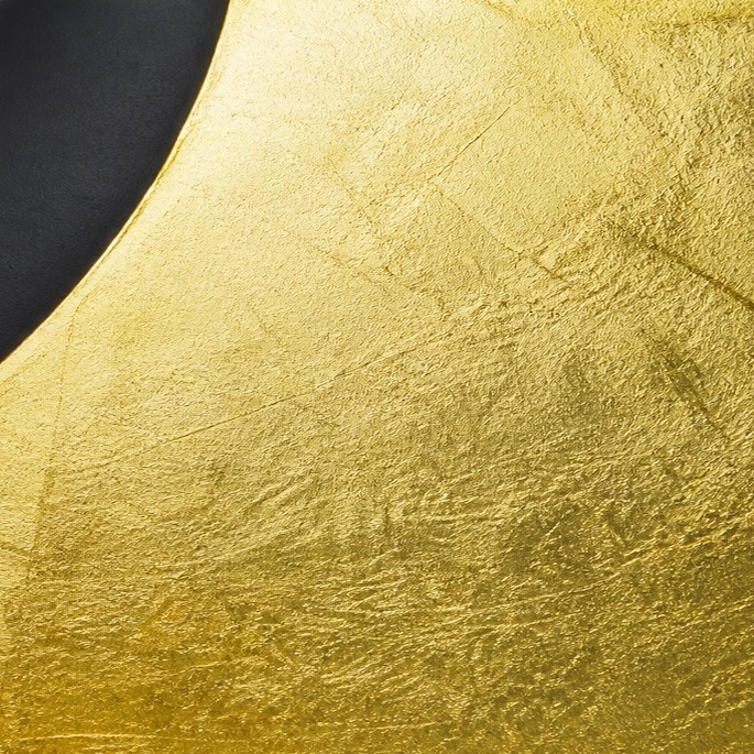 Close-up of the textured gold-leaf finish