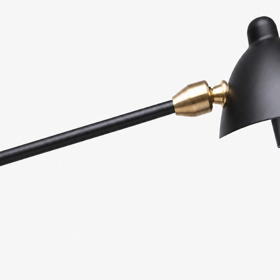 Duckbill wall sconce brass arm and shade joint detail