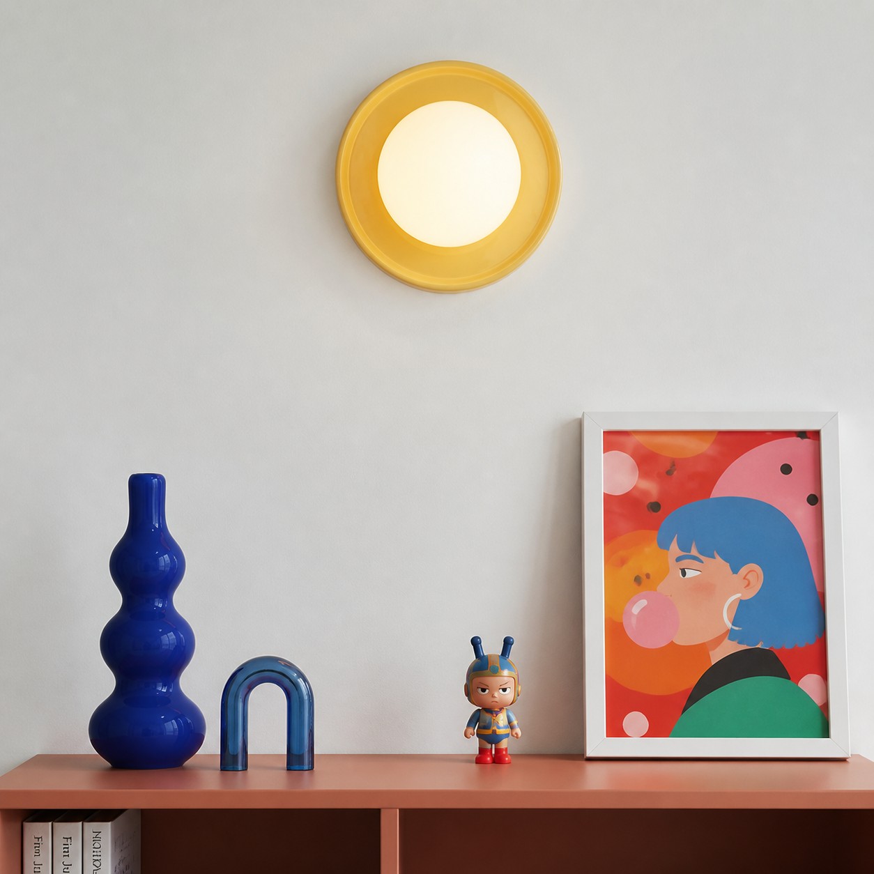 Yellow Solna wall light above a colourful console