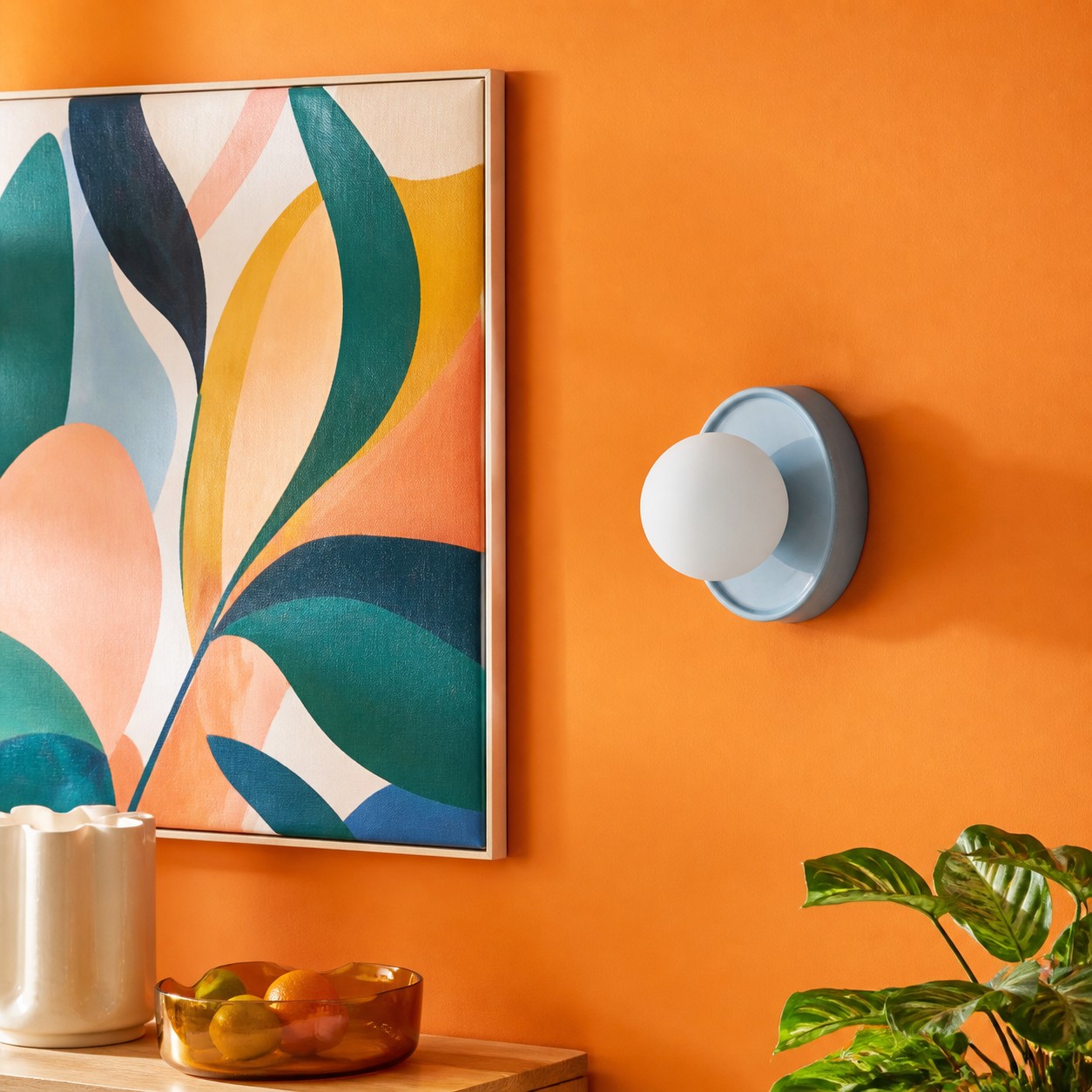 Blue Solna wall light beside abstract artwork