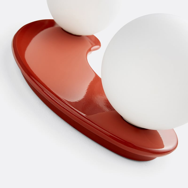 Glossy terracotta base and opal globe detail