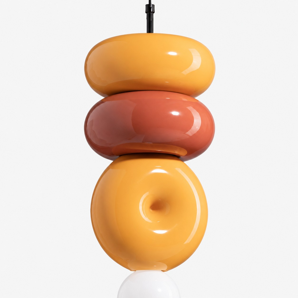 Rounded orange and yellow ceramic forms detail
