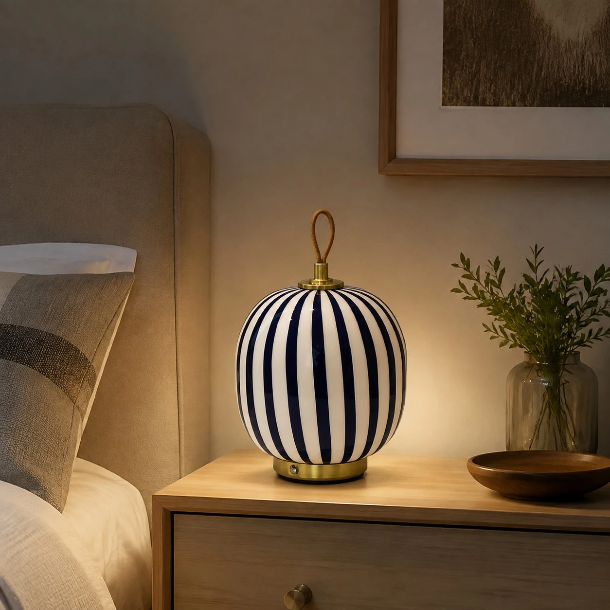 Blue striped glass table lamp in a bedroom
