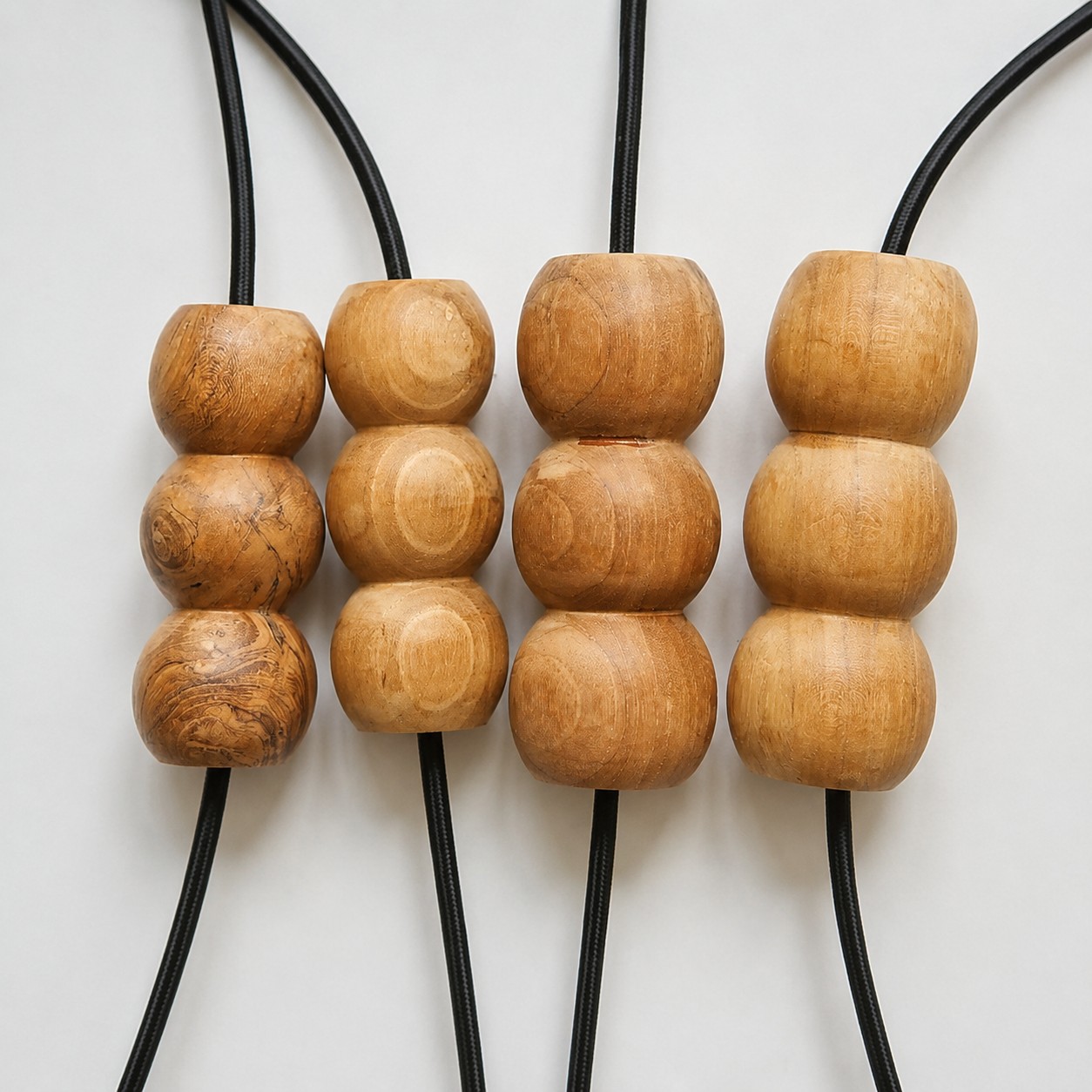 Natural variation across handcrafted wood bead pendant components