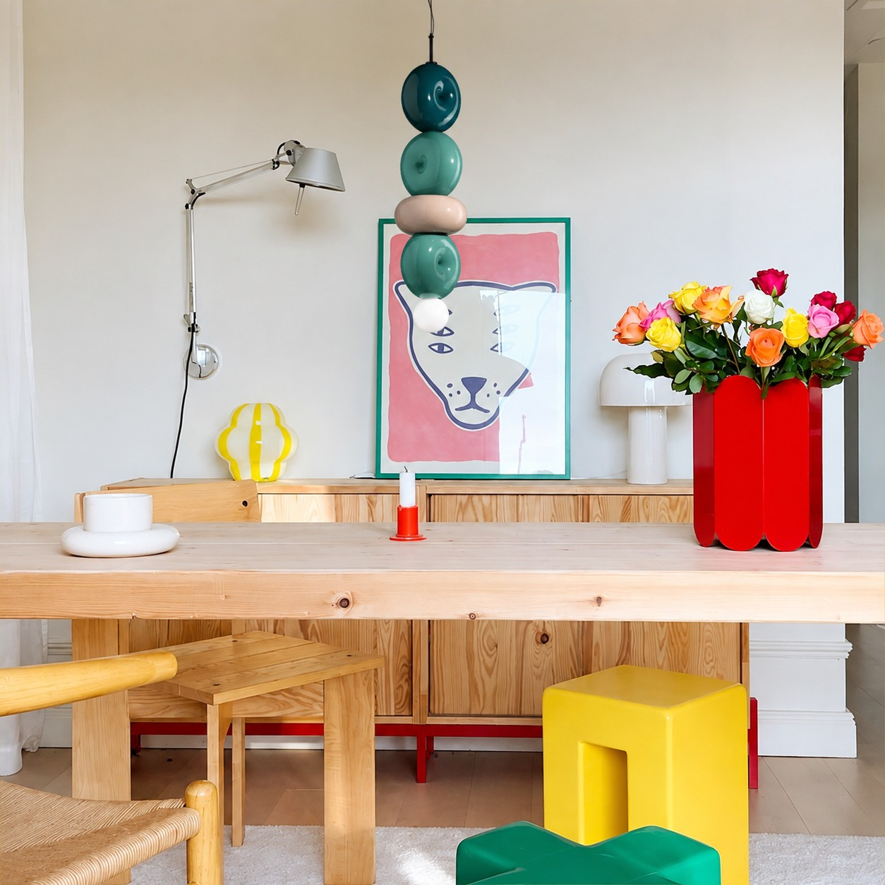 Sculptural teal ceramic pendant in a bright dining space