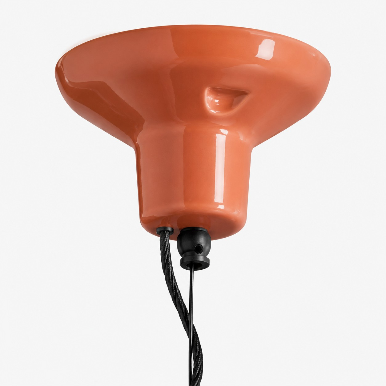 Glossy ceramic ceiling canopy and black cable detail