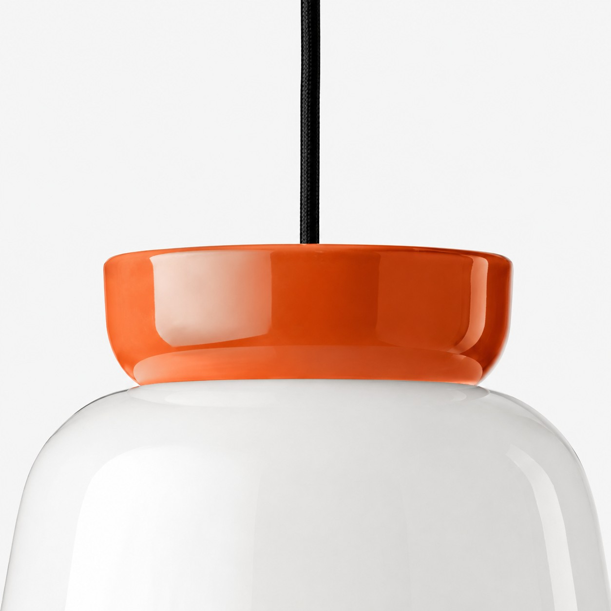 Black cotton-covered cable and ceramic collar connection detail