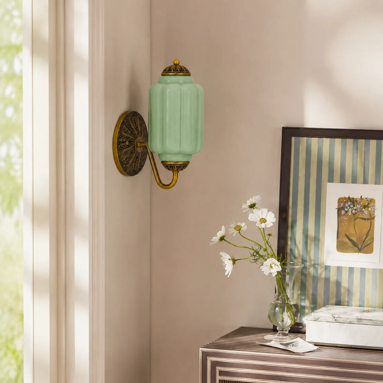 Black and brass Eloise wall sconce in a bright bedroom