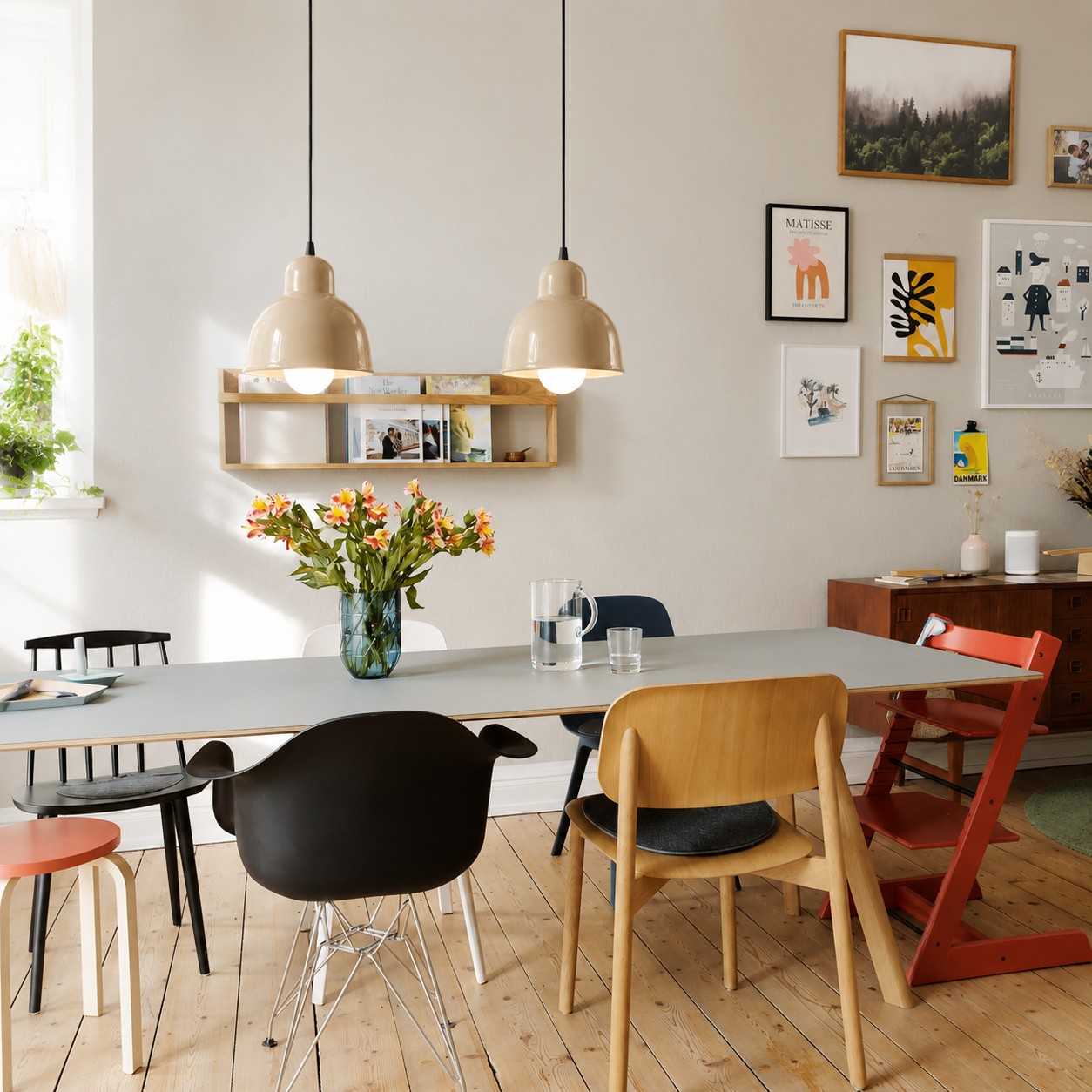 Cream ceramic pendant lamps above a dining room table