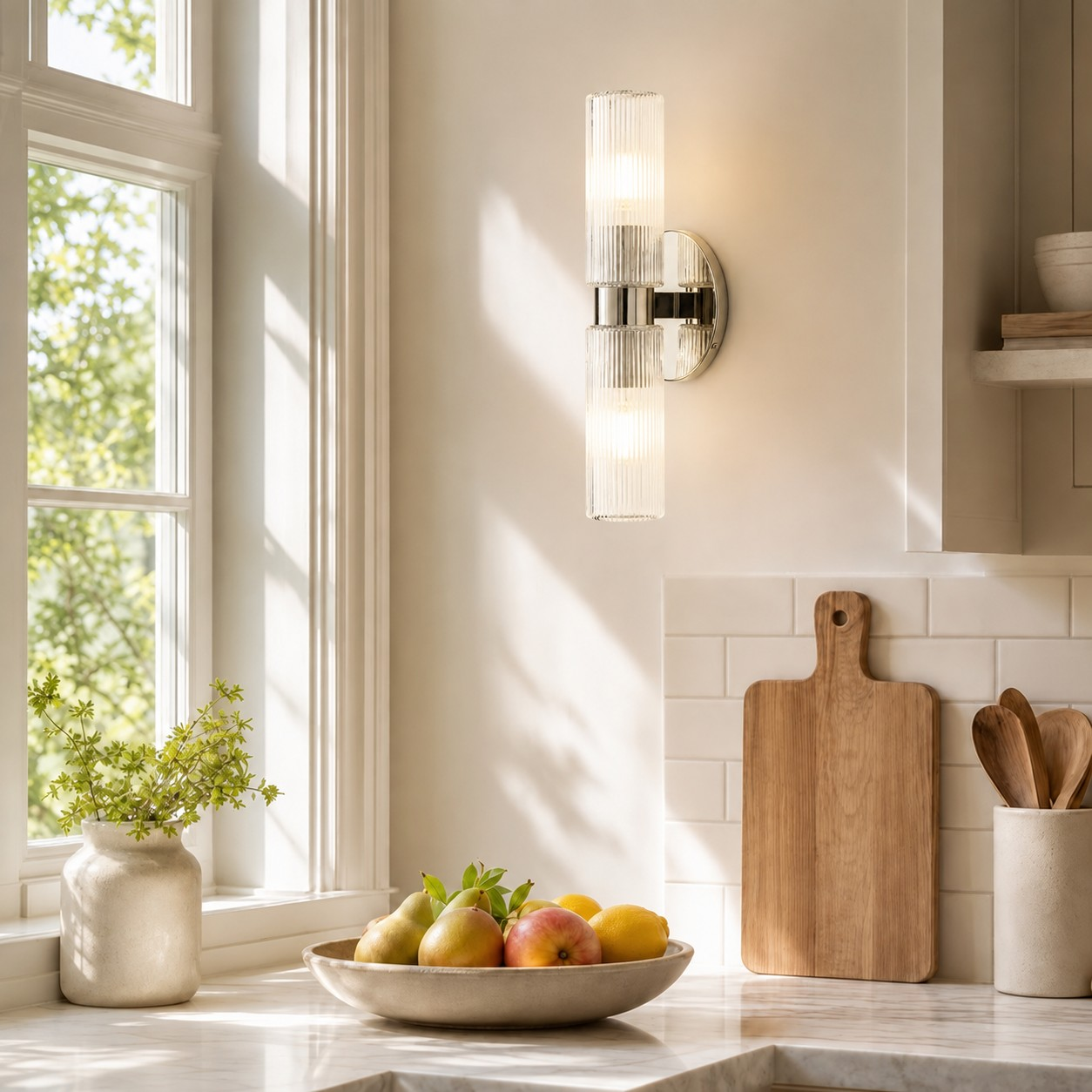Clear glass and polished nickel wall light in a kitchen