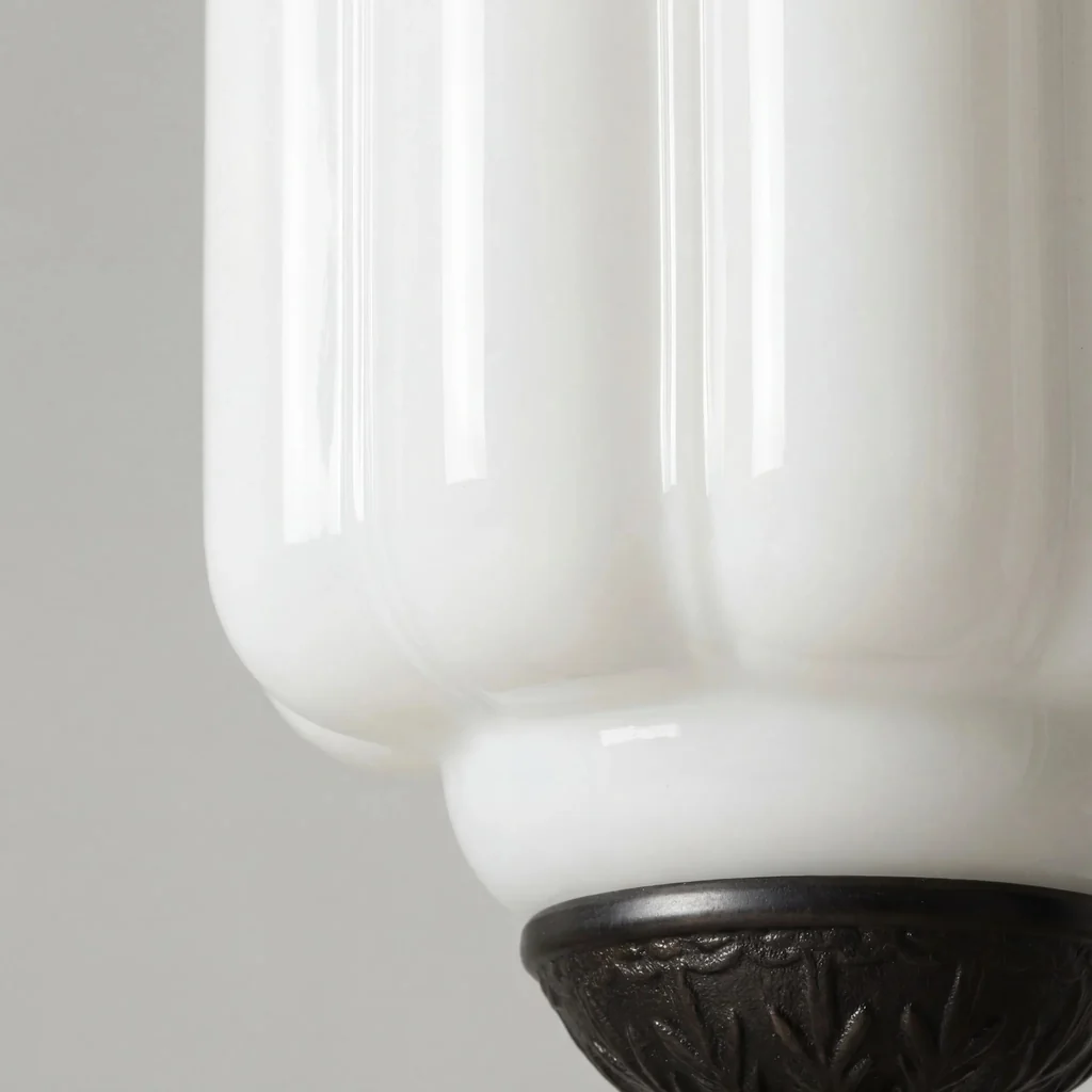 White milk glass shade and ornate dark metal base