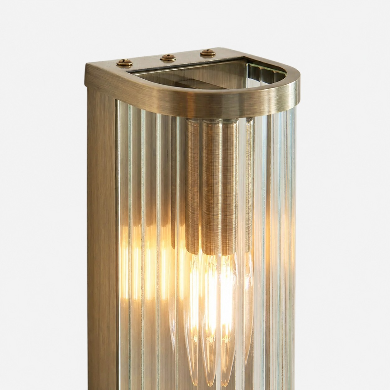 Black RibGlow shade and brass pivot hardware detail