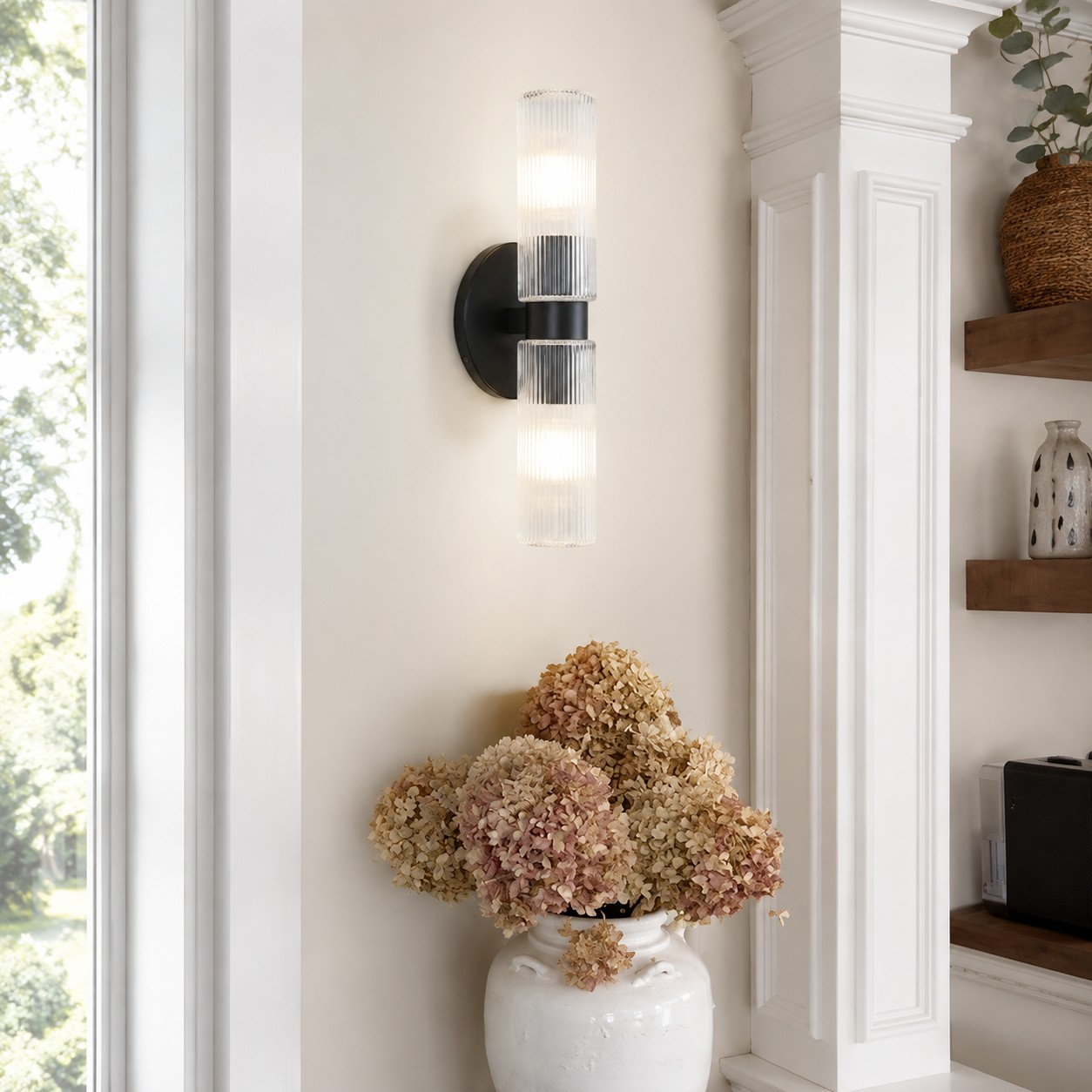 Clear glass and matte black wall light in a bright interior