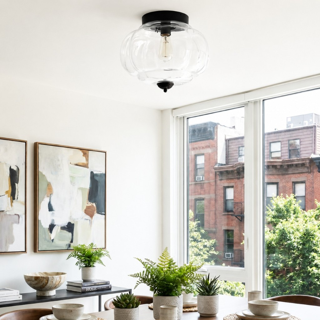 Clear Eloise glass ceiling lamp with black hardware in a dining room