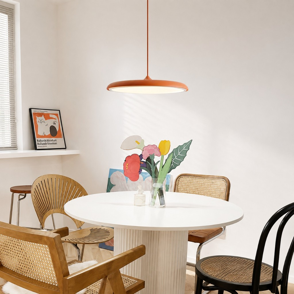 Orange Macaron pendant over a white dining table