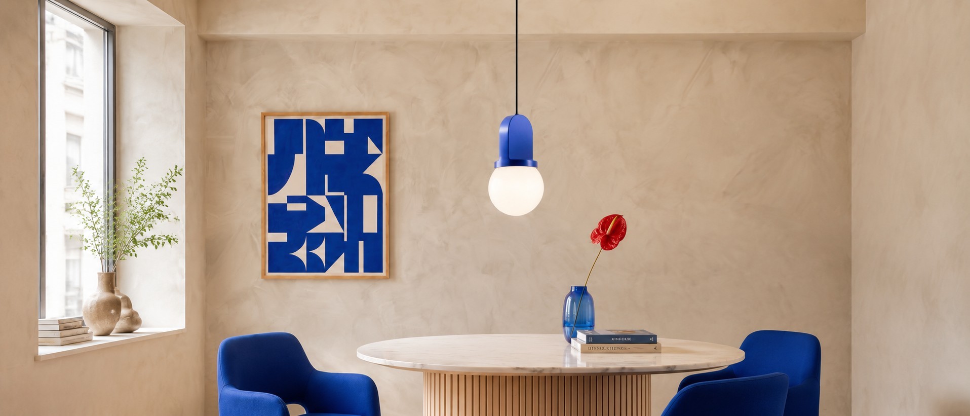 Sculptural ceramic and blown glass pendant lamp in a colorful interior