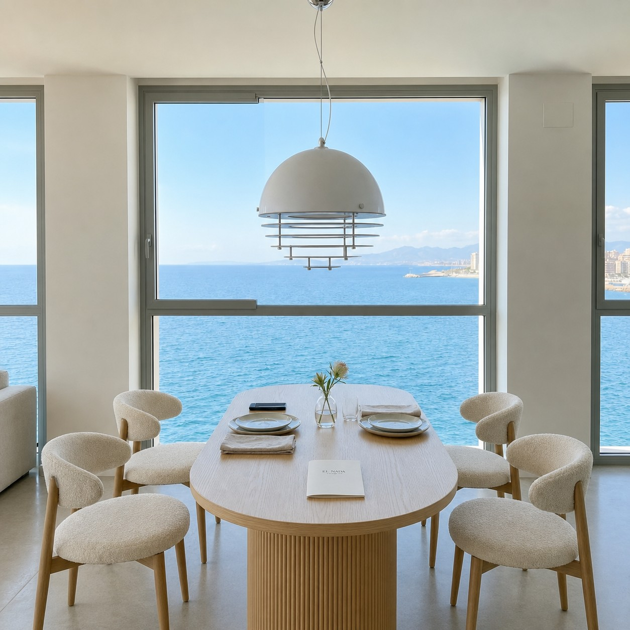 White Sunset pendant above a sea-view dining table