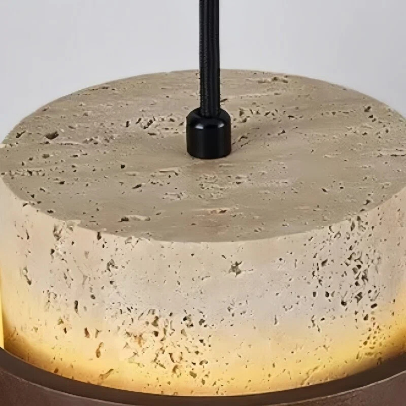 Close view of the travertine shade and suspension fitting