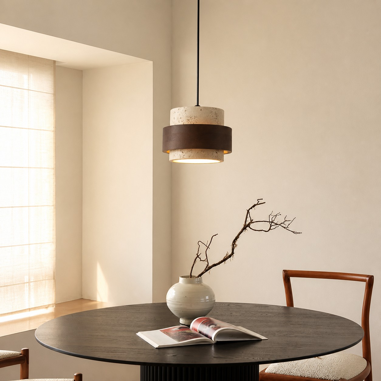 Stonel pendant lamp above a round dining table