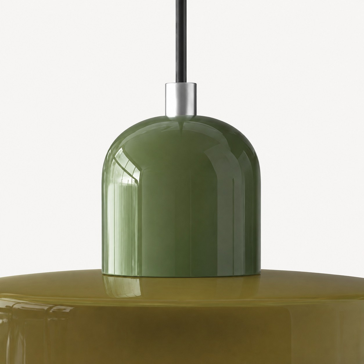 Glossy green glass cap and metal collar detail