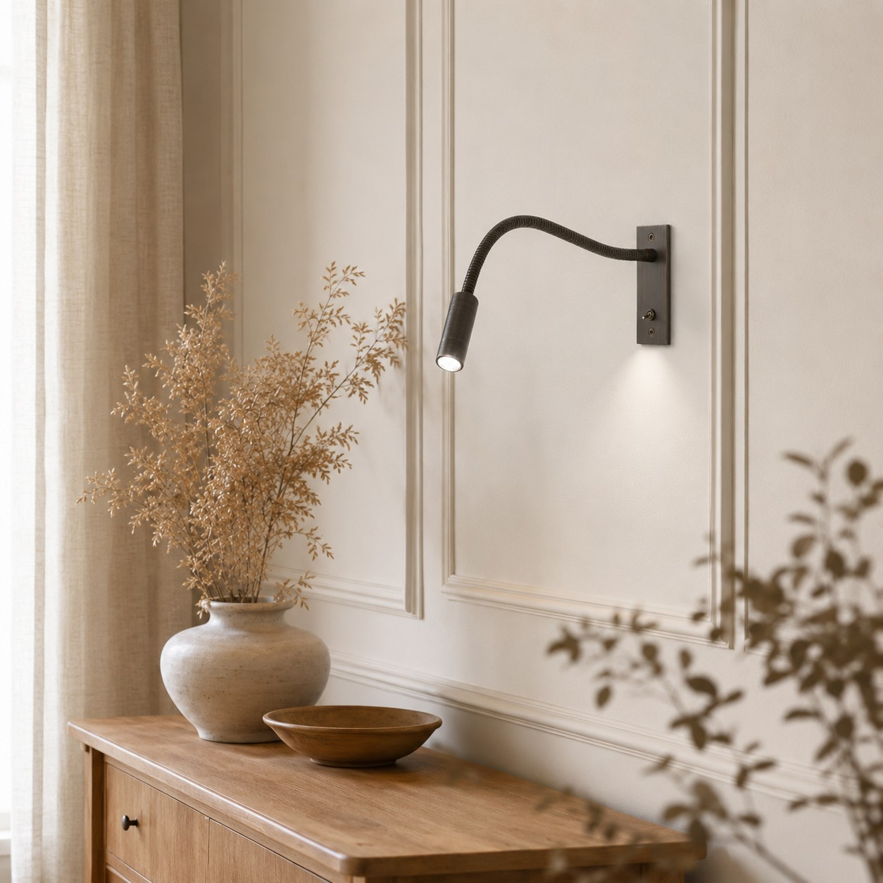 Brushed Bronze flexible wall light above a wooden console
