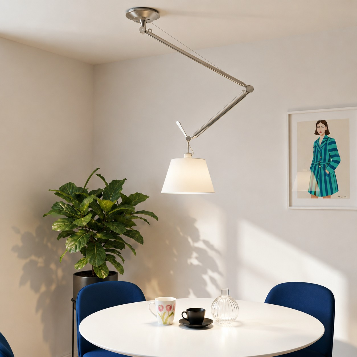 Tolomeo suspension lamp above a colorful dining table