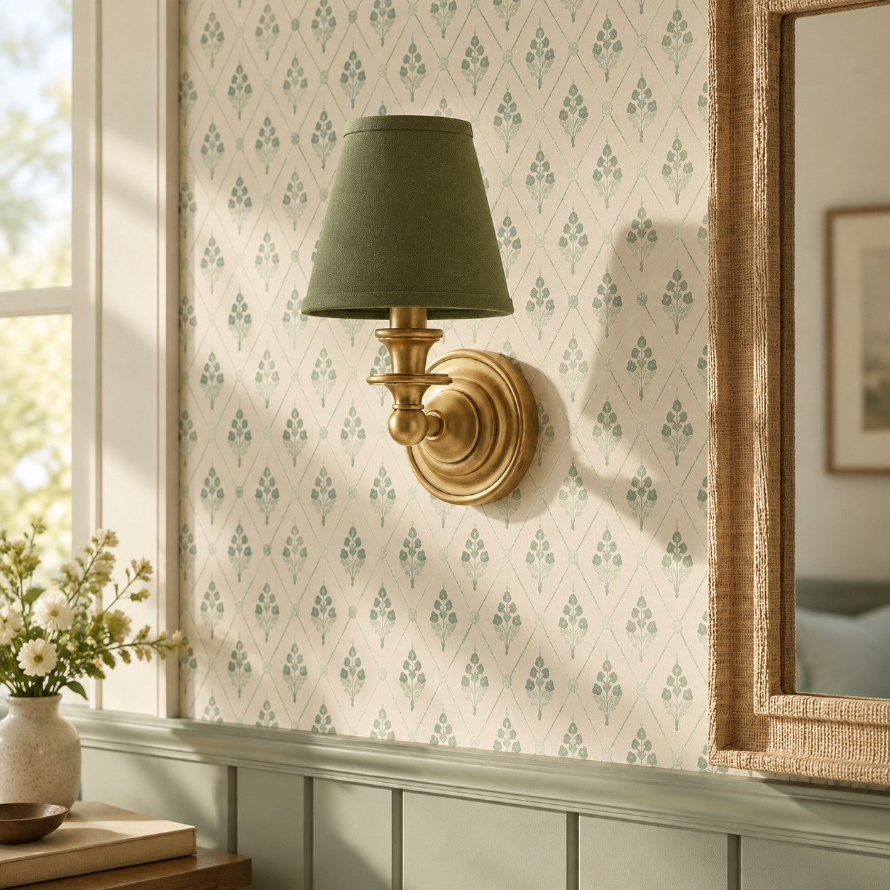Sage green Kalvora wall sconce on patterned wallpaper