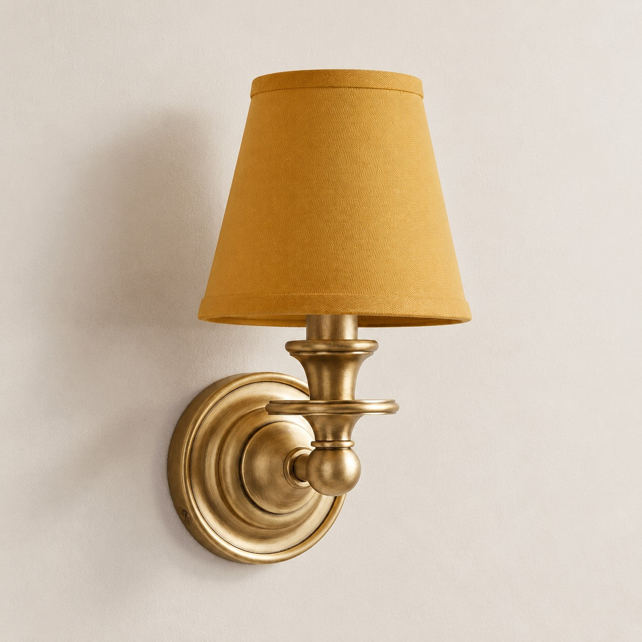 Mustard Yellow Plain Kalvora fabric shade wall sconce in Brass
