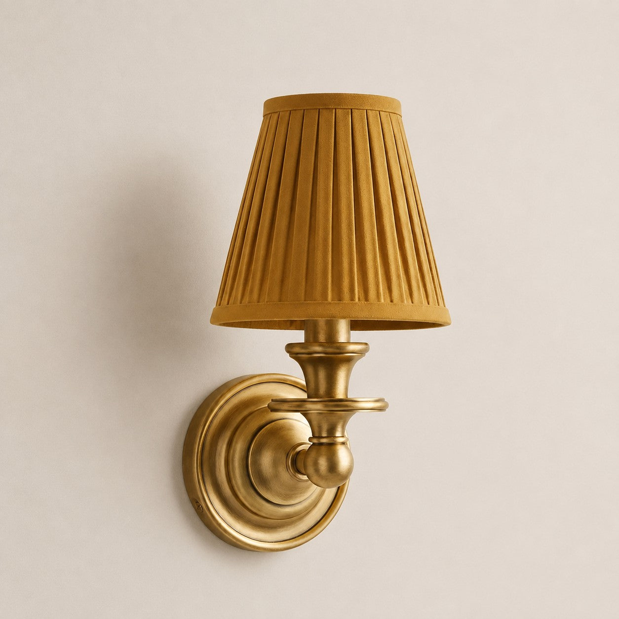 Mustard Yellow Pleated Kalvora fabric shade wall sconce in Brass