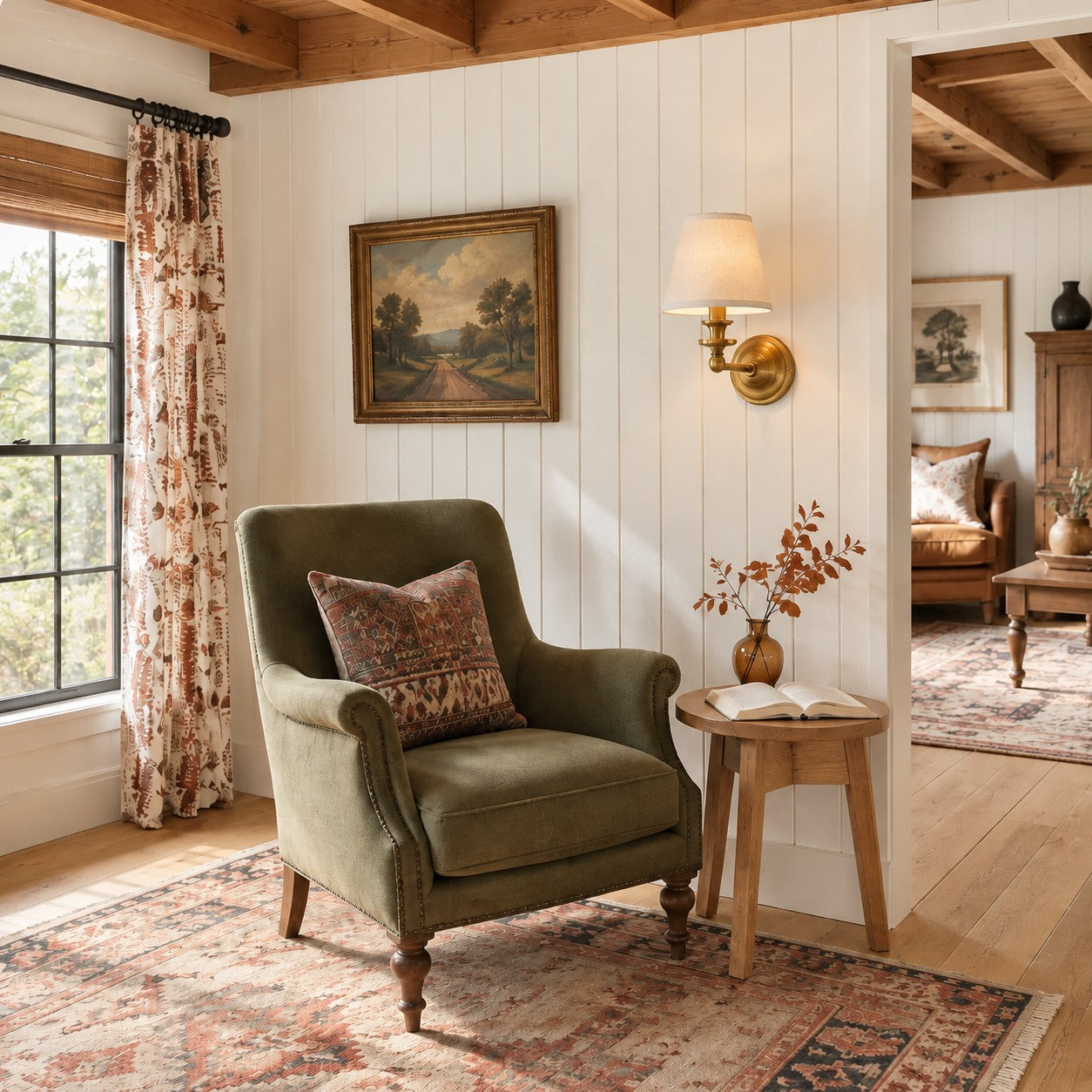 Brass Kalvora wall sconce in a shiplap reading nook