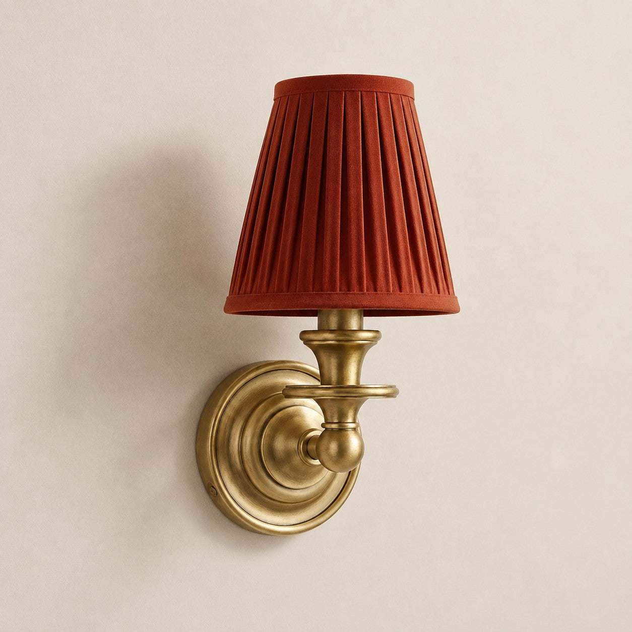 Red Pleated Kalvora fabric shade wall sconce in Brass