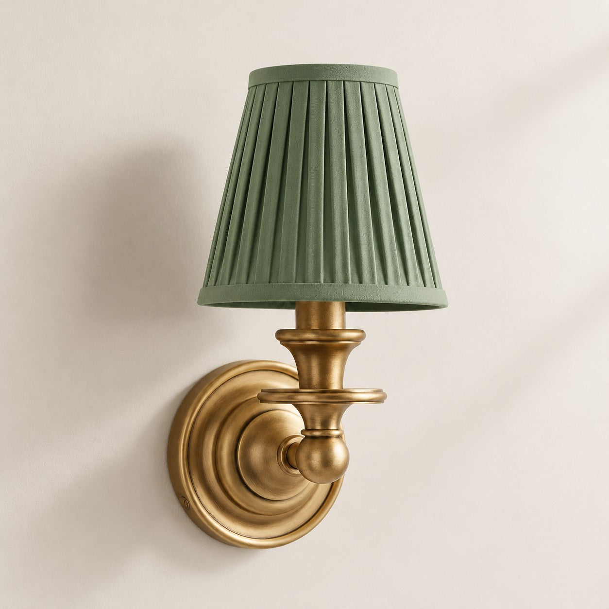 Sage Green Pleated Kalvora fabric shade wall sconce in Brass