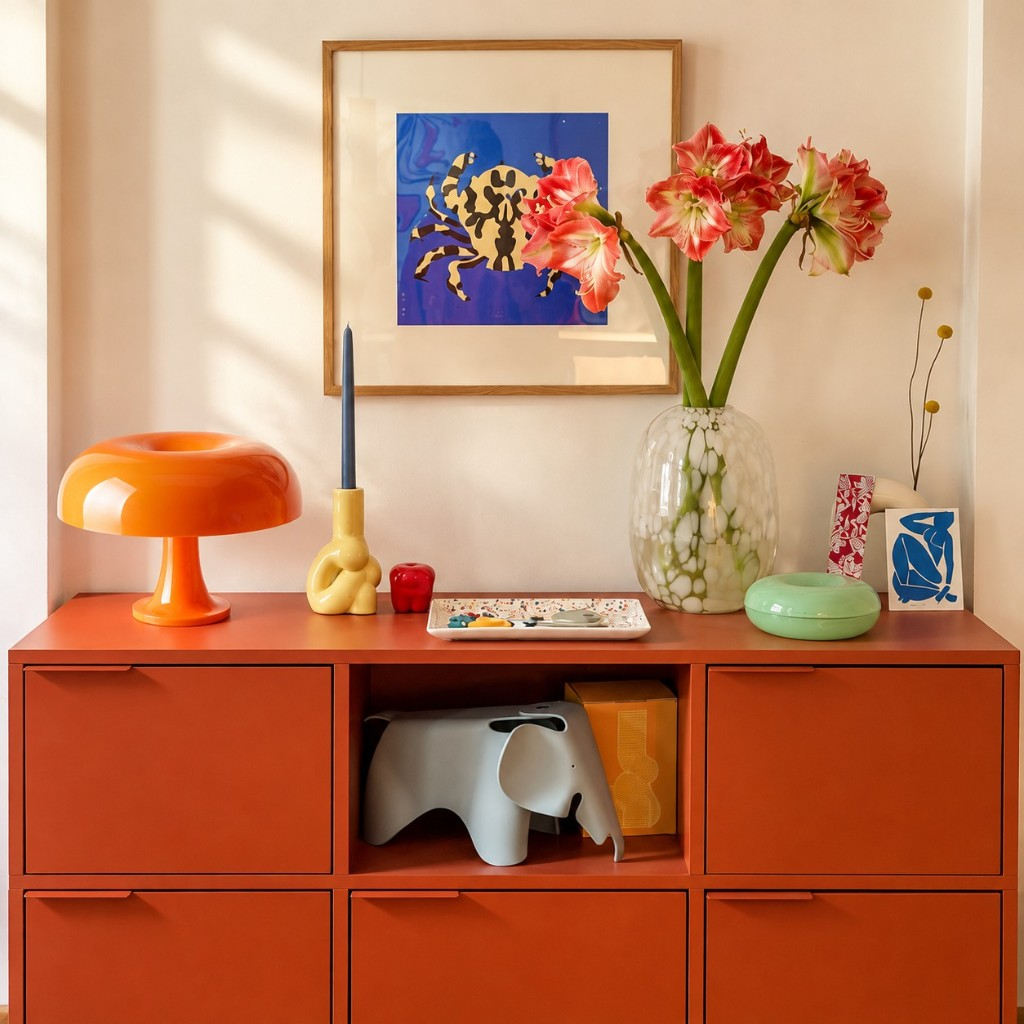 Orange Nessino table lamp on a terracotta cabinet