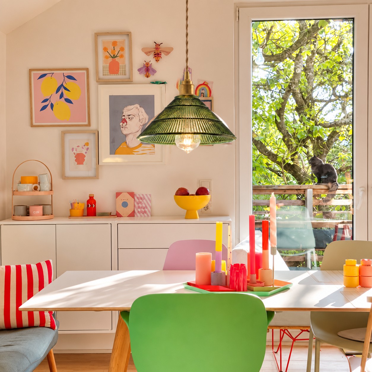 Green pendant light in a colorful dining room