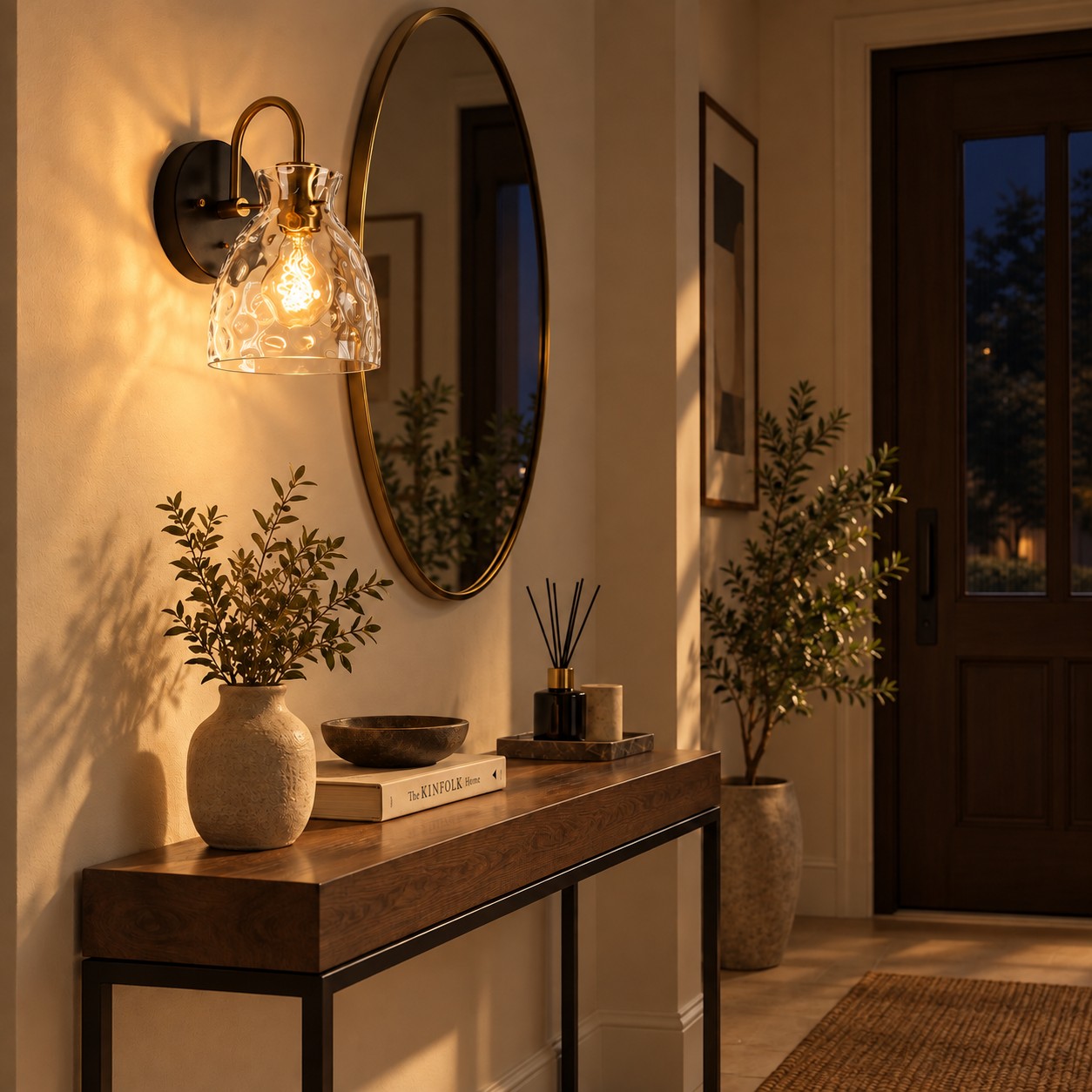 Textured Glass Wall Sconce with a clear shade and a curved arm