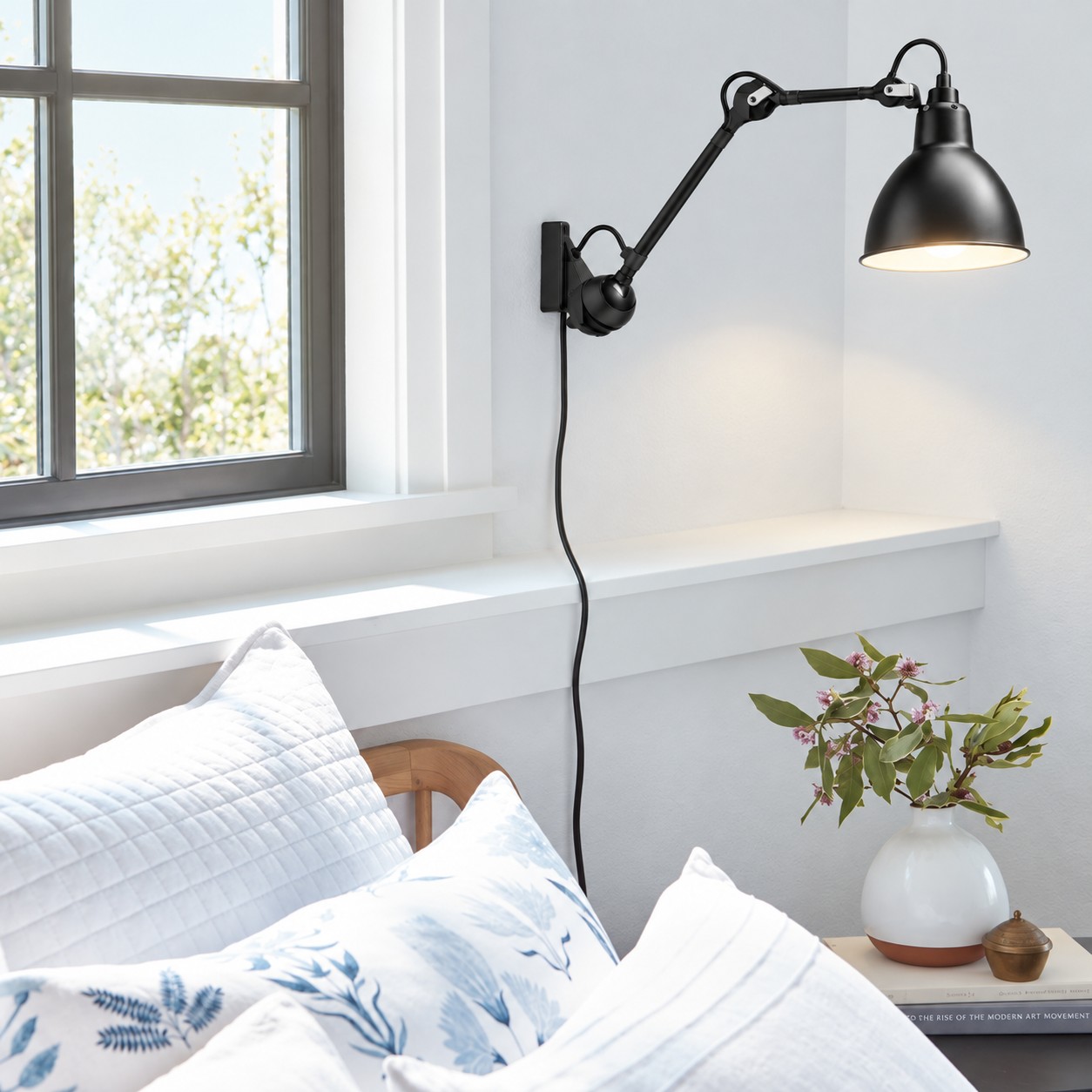 Industrial adjustable arm wall light in an interior
