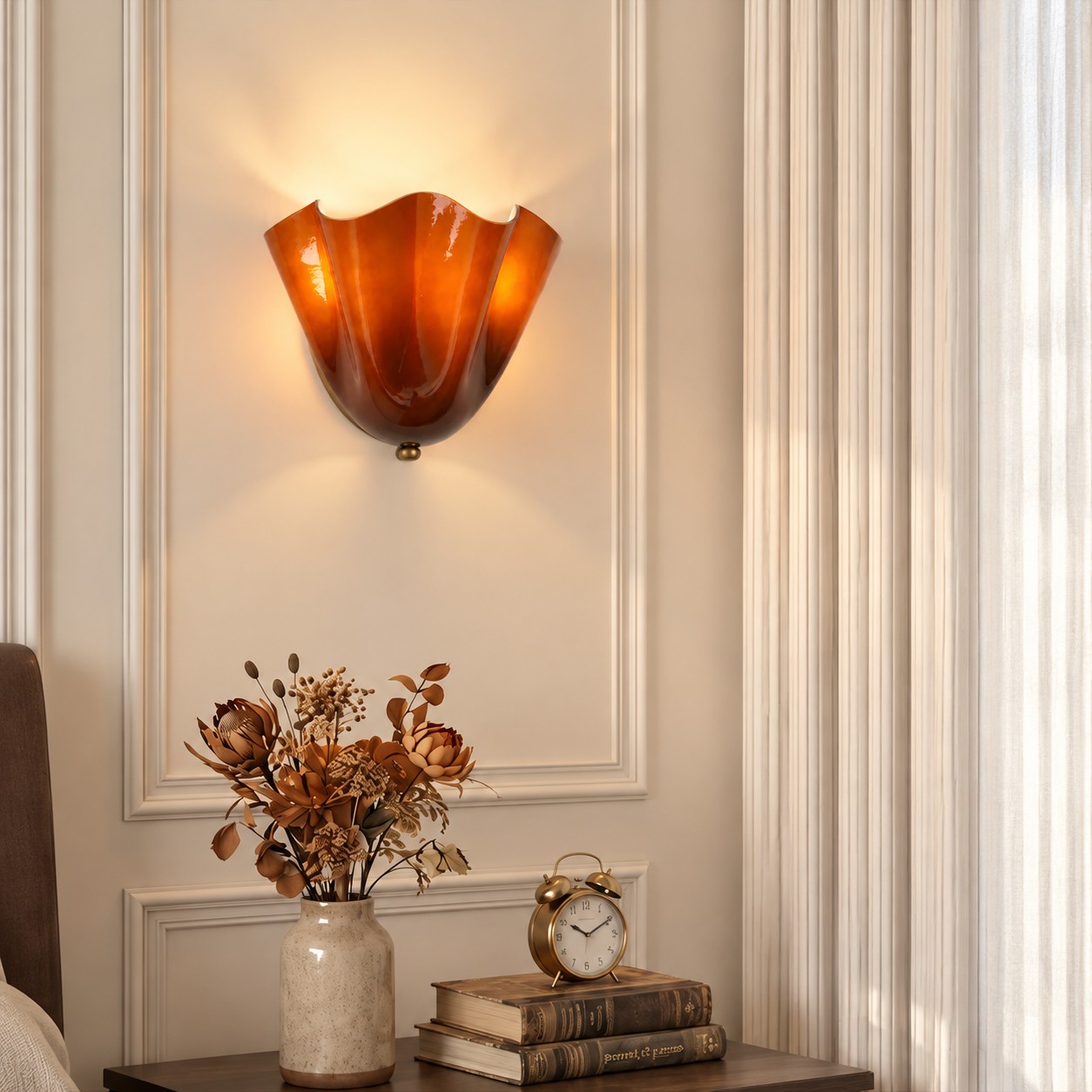 Amber seashell sconce beside a console