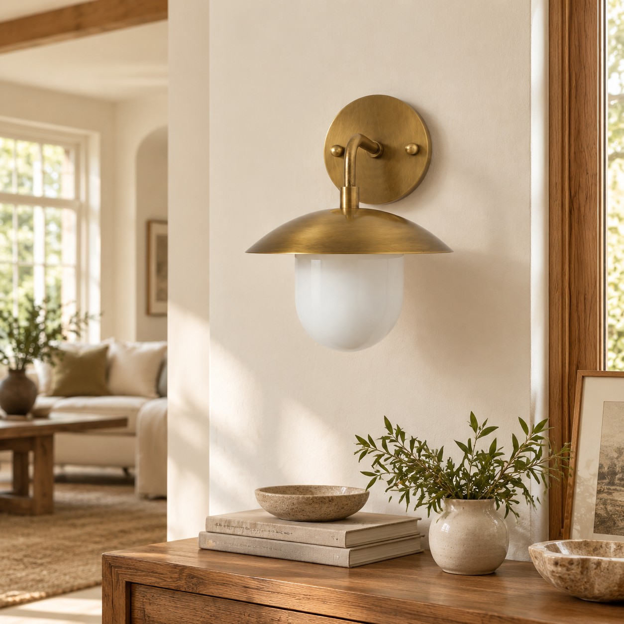 Sculptural Glass Wall Sconce with a brass finish and one to three lights
