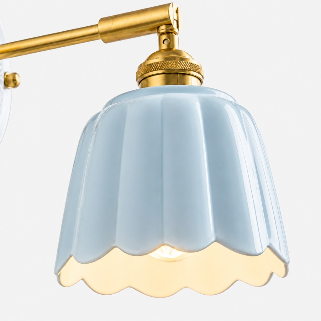 Scalloped ceramic shade with the bulb visible underneath