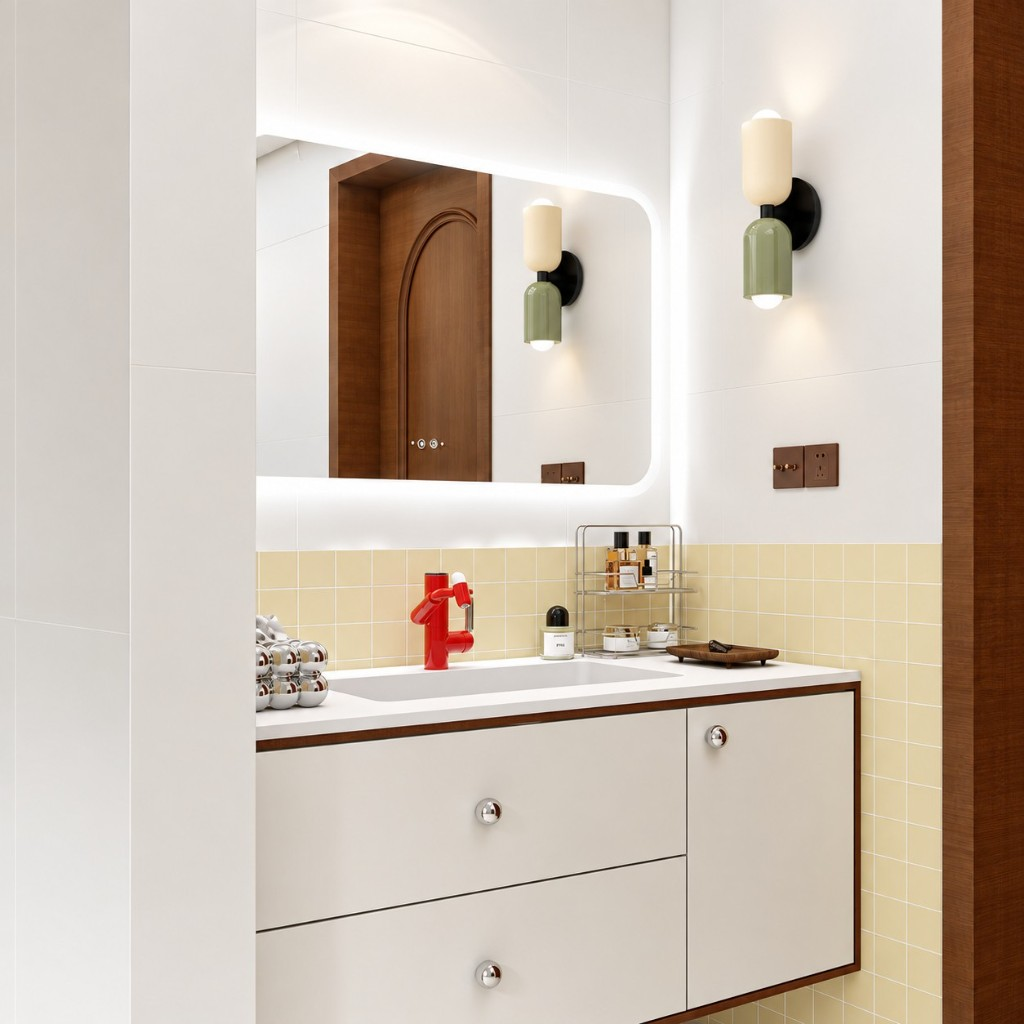 Green and cream capsule wall sconce beside a bathroom mirror