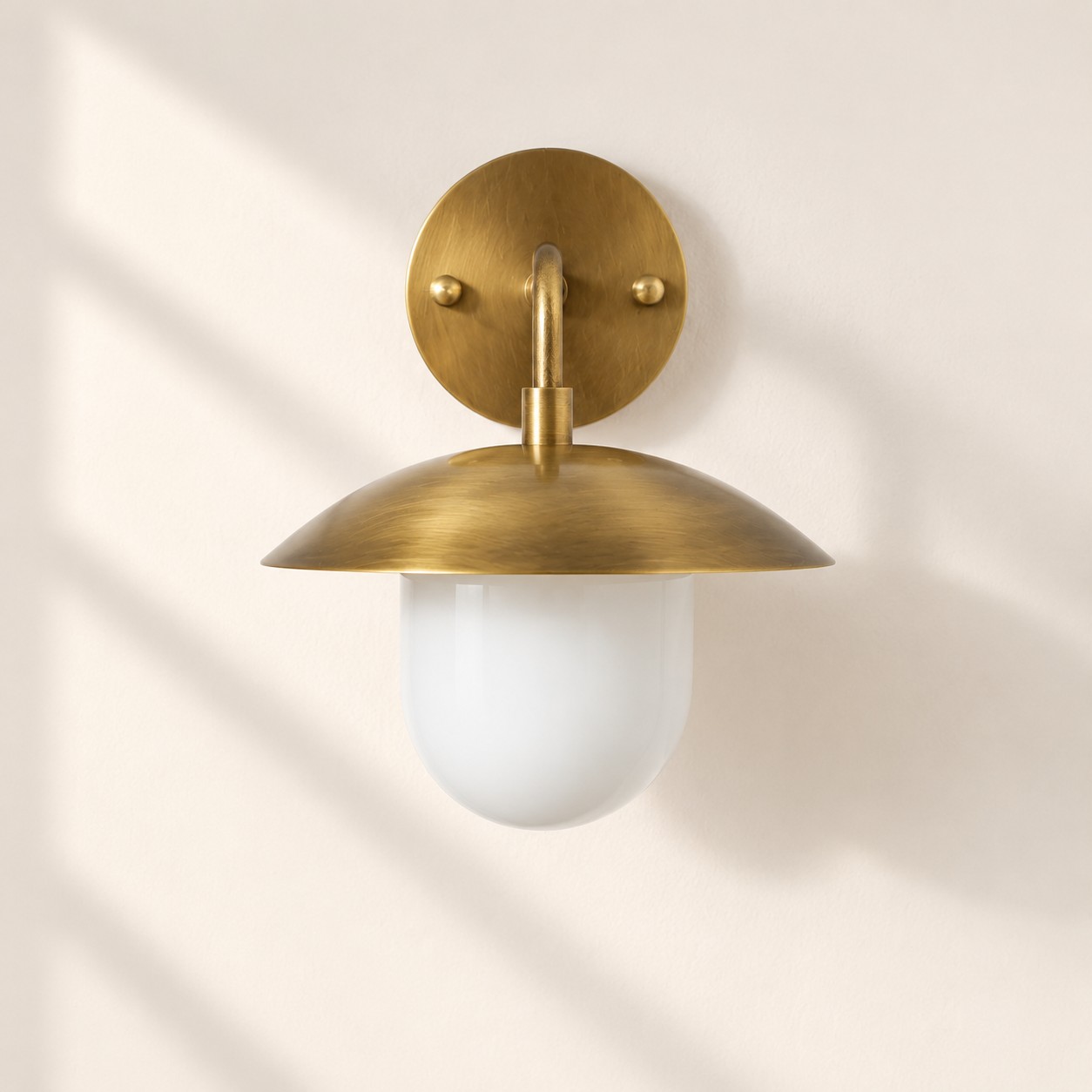 Sculptural Glass Wall Sconce with a brass finish and one to three lights