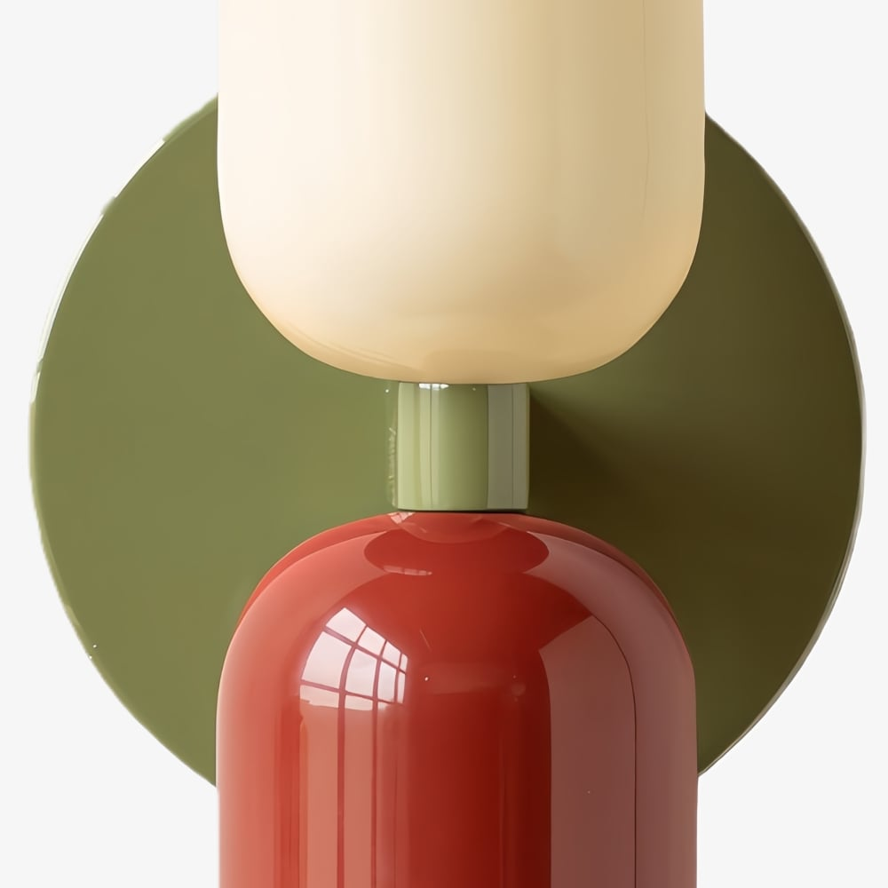 Cream and red capsules on a green backplate
