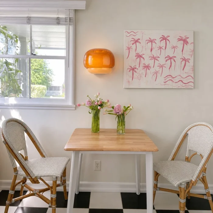 Orvenis orange wall light in a bright dining room