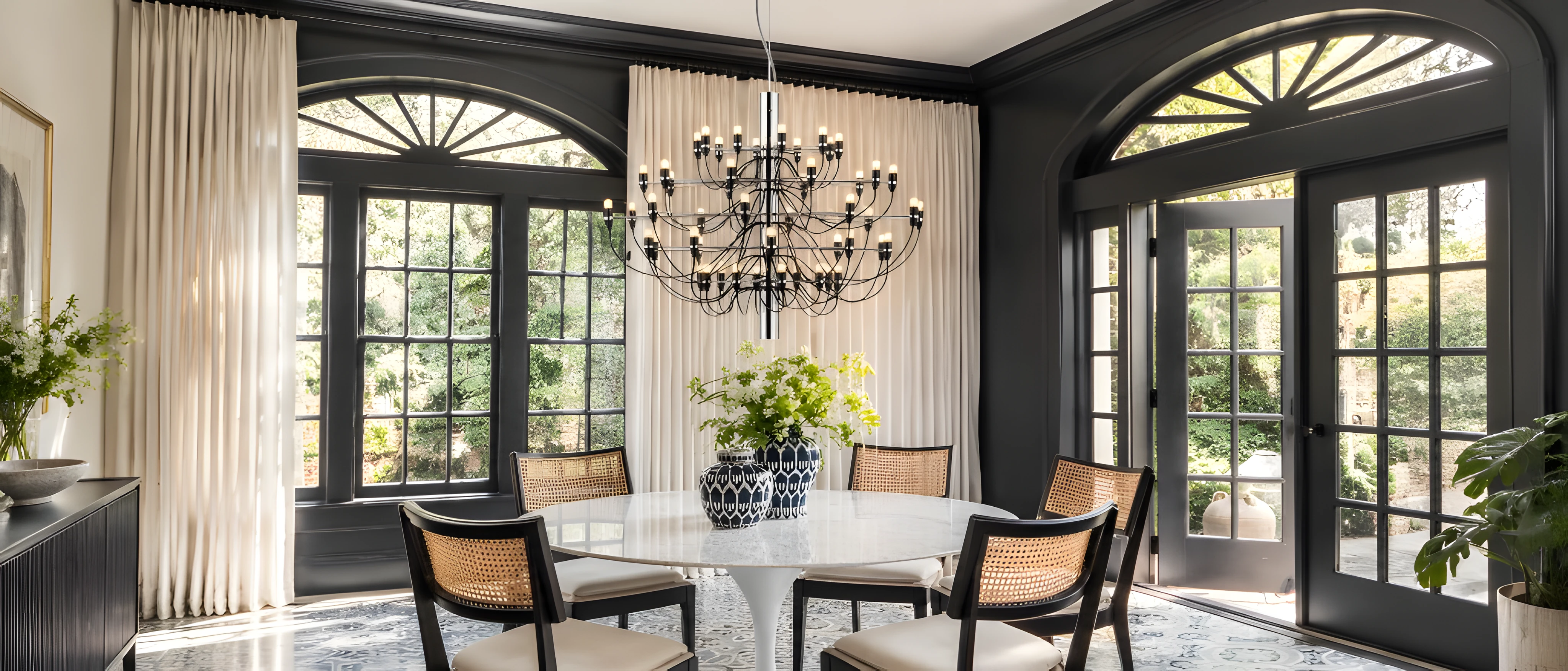 Chrome branching chandelier above a dining table