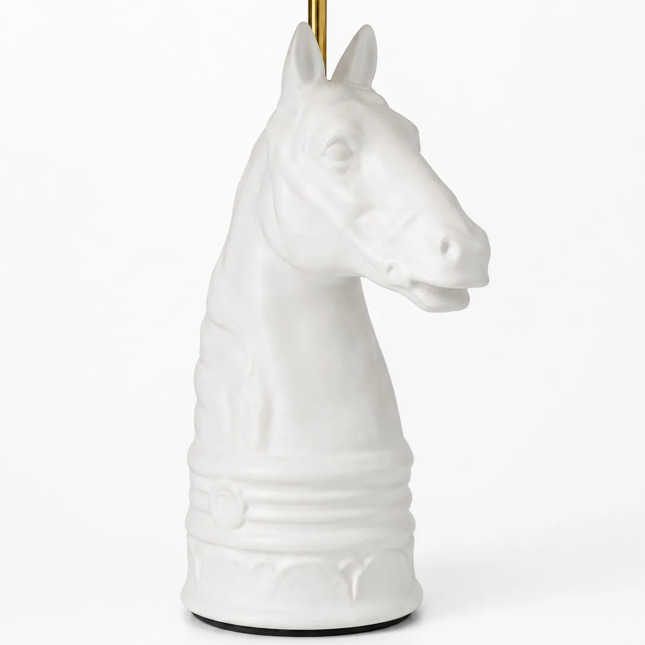 Close detail of white horse head table lamp base