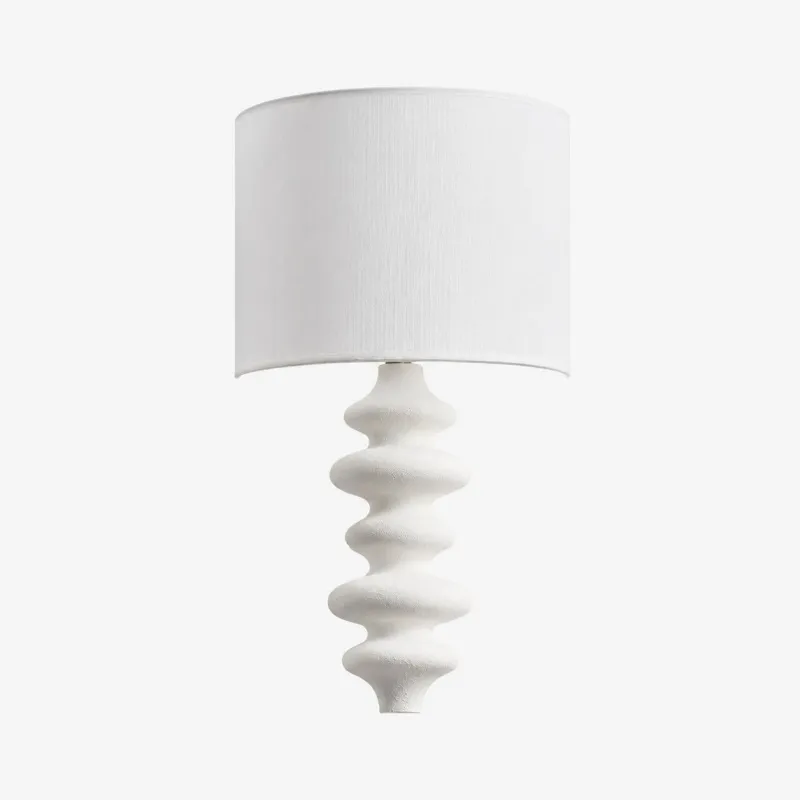 White sculptural wall lamp with white fabric shade