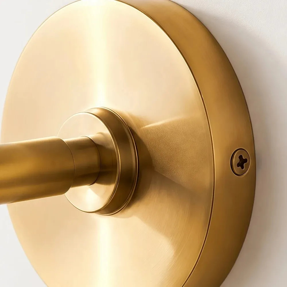 Gold wall plate and arm detail