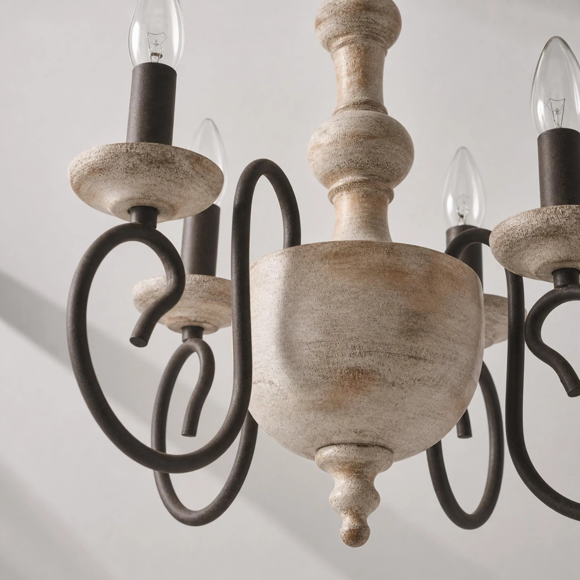 distressed white and dark metal chandelier body detail